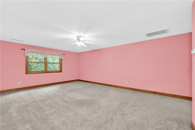 empty room featuring carpet and ceiling fan