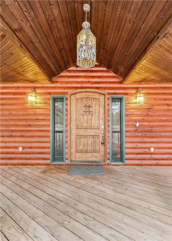 property entrance featuring a wooden deck