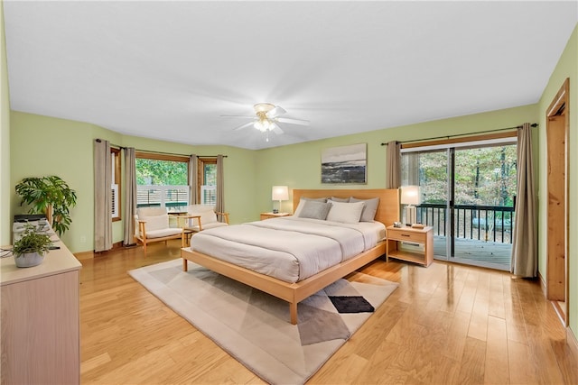 bedroom with light hardwood / wood-style flooring, multiple windows, access to outside, and ceiling fan