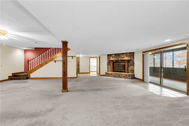 unfurnished living room with a fireplace and carpet flooring