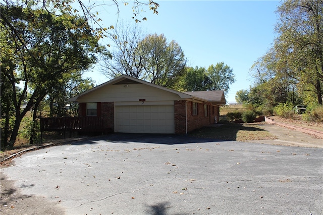 view of side of home featuring a garage