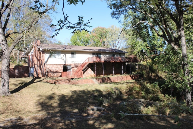 rear view of house with a wooden deck