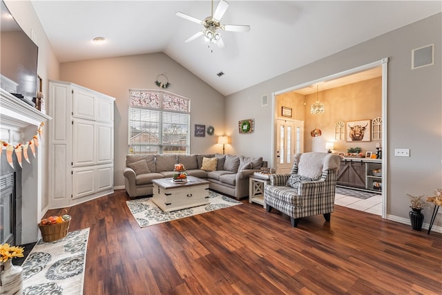 living room with dark hardwood / wood-style flooring, high vaulted ceiling, and ceiling fan