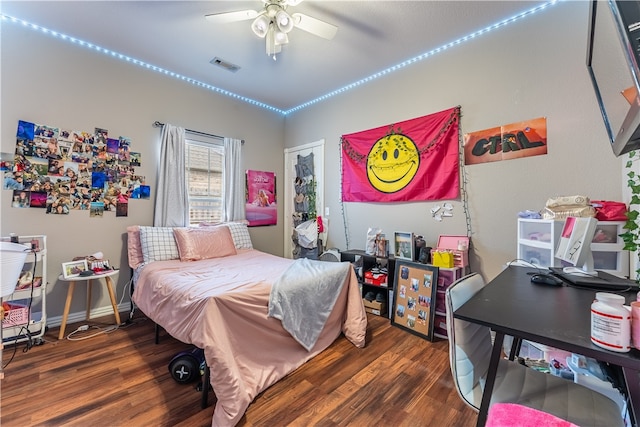 bedroom with dark wood-type flooring and ceiling fan