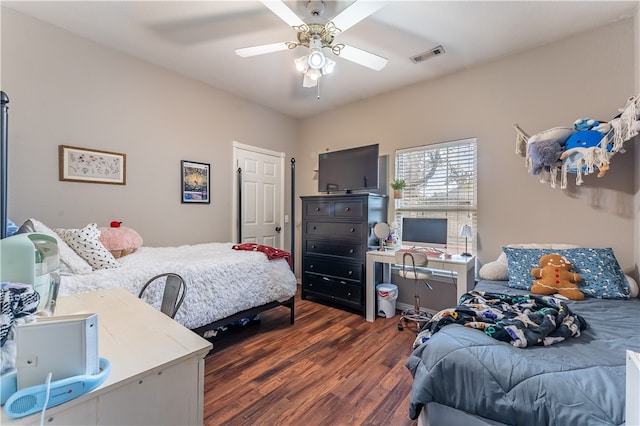 bedroom featuring dark hardwood / wood-style flooring and ceiling fan