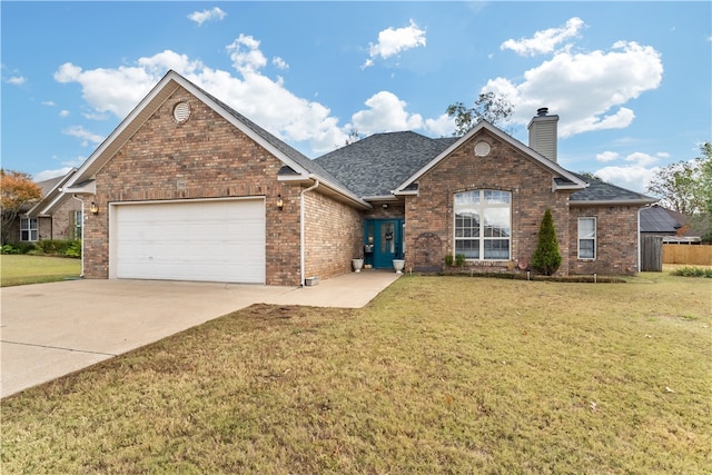 front facade with a garage and a front yard