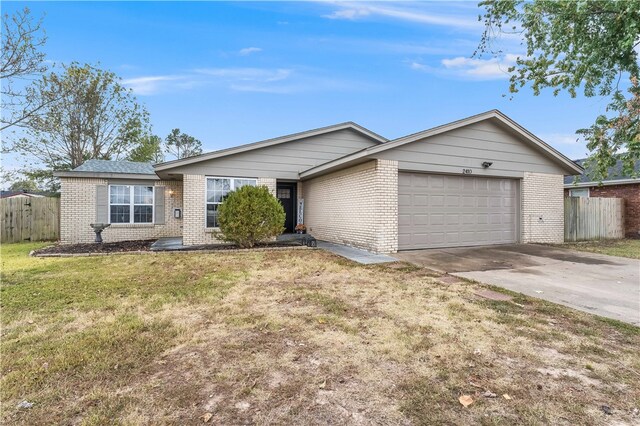 ranch-style house with a front lawn and a garage