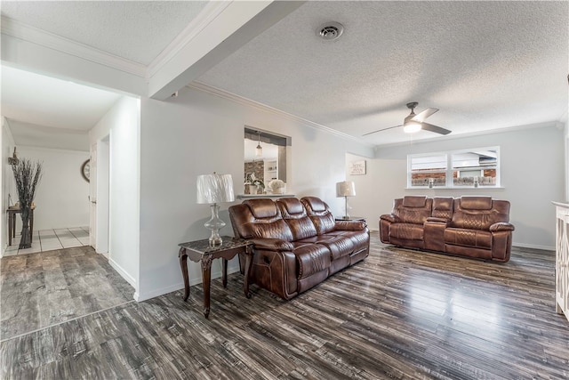 living room with a textured ceiling, ceiling fan, and dark hardwood / wood-style flooring