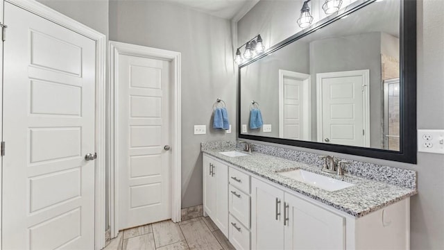 bathroom with double vanity and a sink