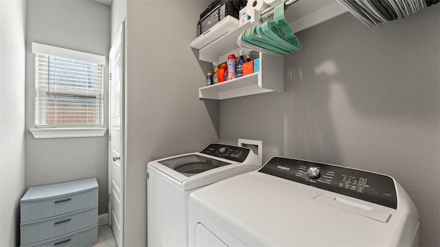 washroom featuring laundry area and washer and clothes dryer