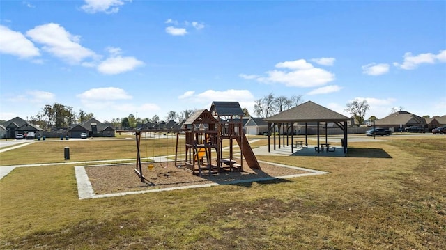 community playground with a residential view, a lawn, and a gazebo