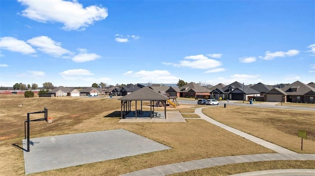 view of community with a gazebo, a yard, and a residential view