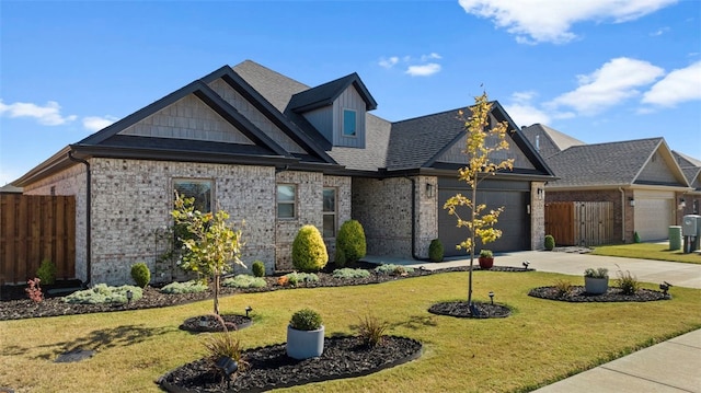 view of front facade with a garage and a front lawn