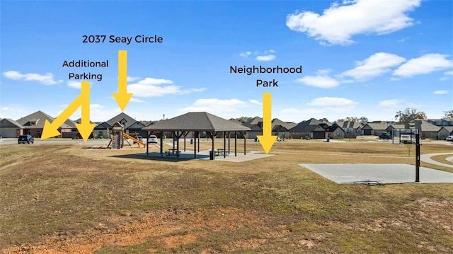 view of community with a gazebo, playground community, a residential view, and a lawn