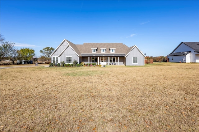 view of front facade featuring a porch and a front lawn