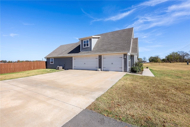 view of front of house with a front lawn and a garage