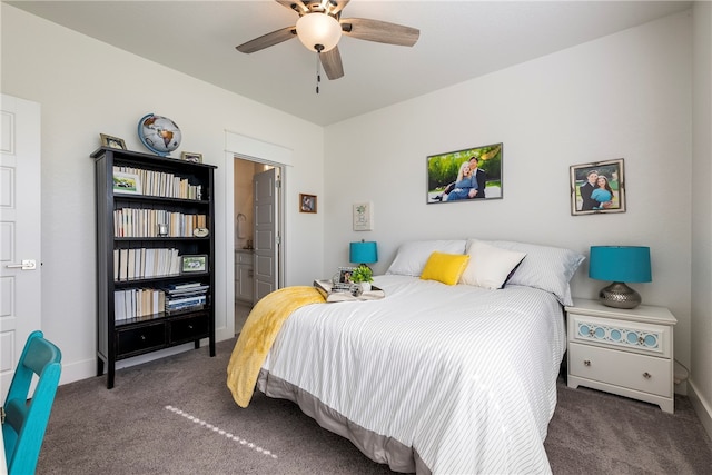 carpeted bedroom with ensuite bath and ceiling fan