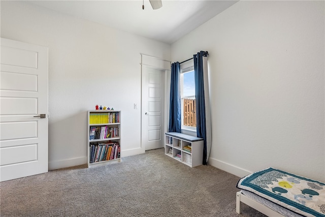 bedroom featuring light carpet and ceiling fan