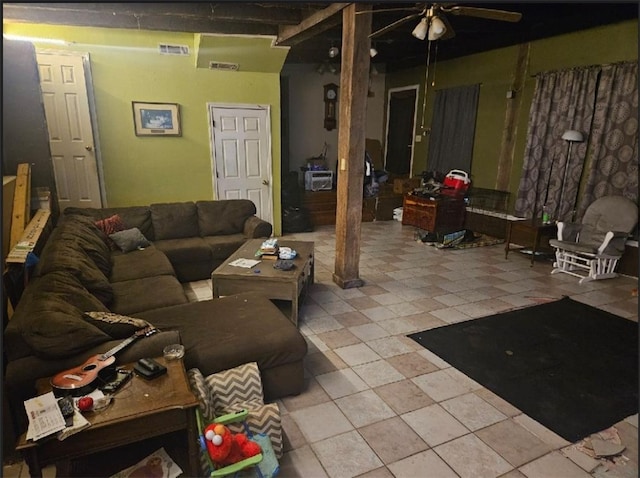 tiled living room featuring ceiling fan