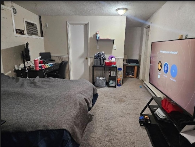 carpeted bedroom featuring a textured ceiling