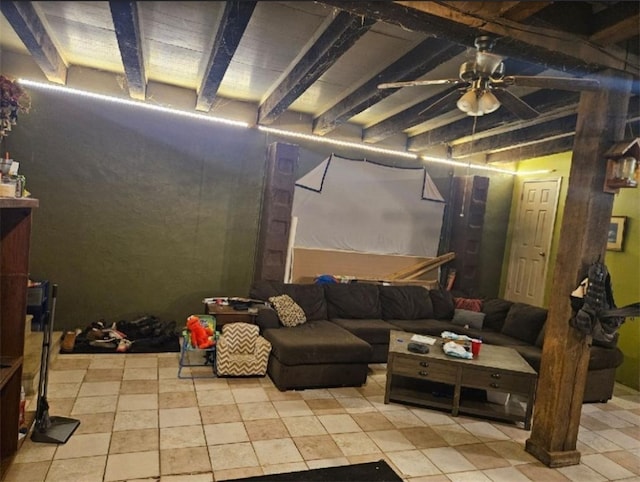 basement featuring light tile patterned floors and ceiling fan