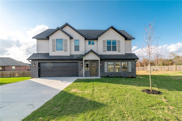 craftsman-style house with a front yard and a garage