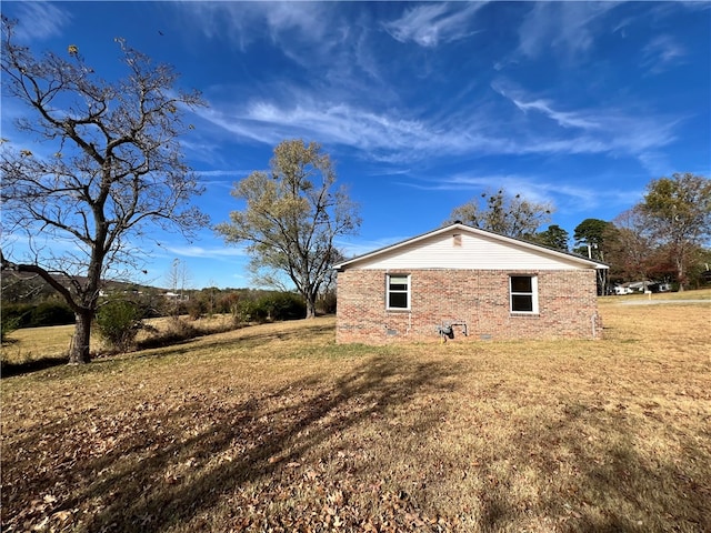 view of property exterior featuring a lawn