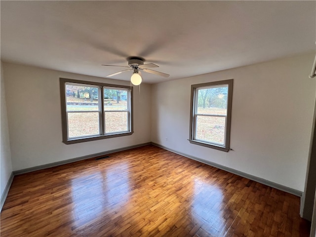 unfurnished room featuring wood-type flooring and ceiling fan