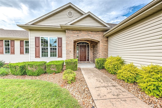 property entrance with brick siding