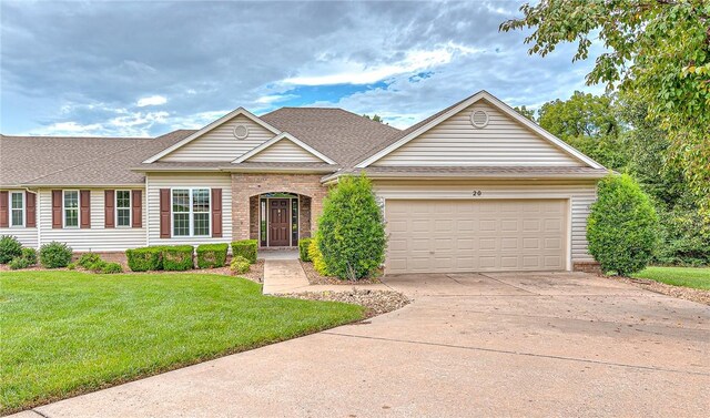 single story home featuring a front lawn and a garage