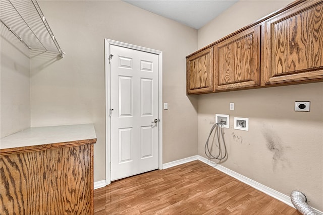 laundry room with cabinet space, light wood finished floors, baseboards, washer hookup, and electric dryer hookup