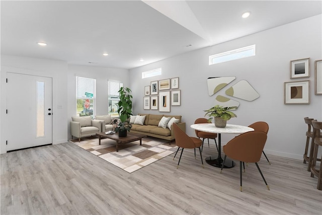 living room with light hardwood / wood-style flooring