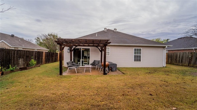 rear view of house with a pergola, a patio area, and a yard