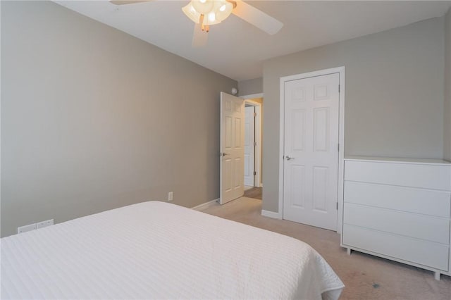 bedroom with ceiling fan and light colored carpet