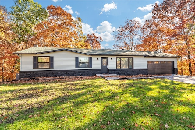 single story home with a front yard and a garage