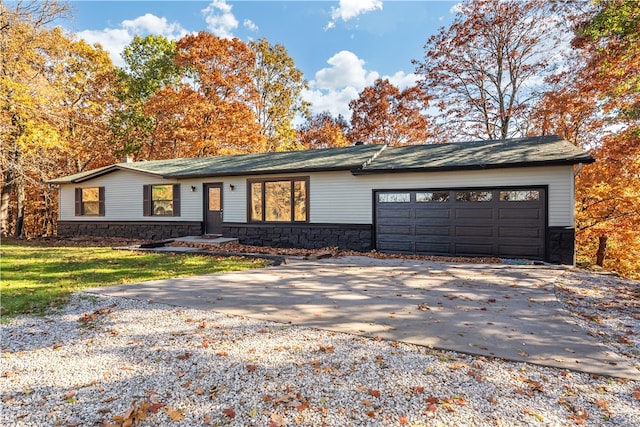 ranch-style house featuring a garage