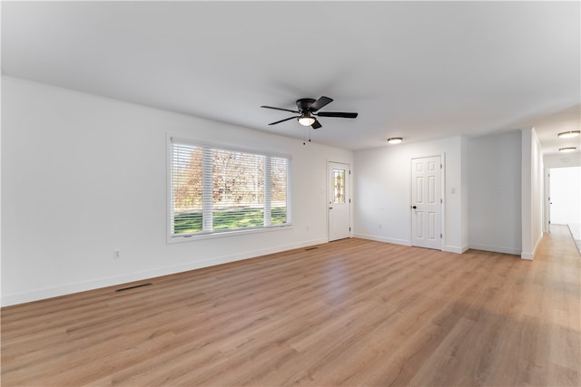 unfurnished living room with ceiling fan and light hardwood / wood-style flooring