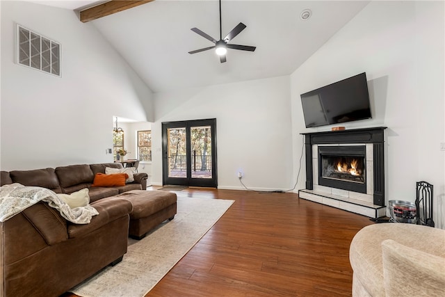 living room featuring ceiling fan, beam ceiling, high vaulted ceiling, hardwood / wood-style floors, and french doors