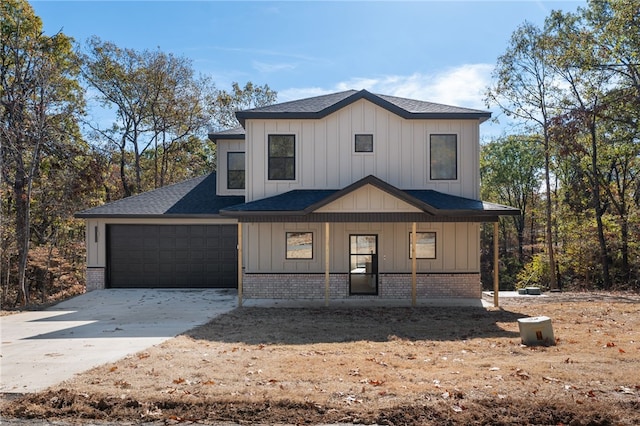 view of front facade featuring a porch and a garage