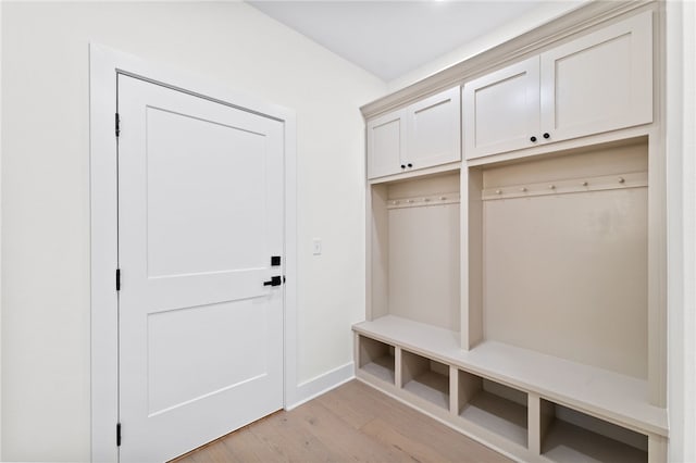 mudroom with light hardwood / wood-style floors