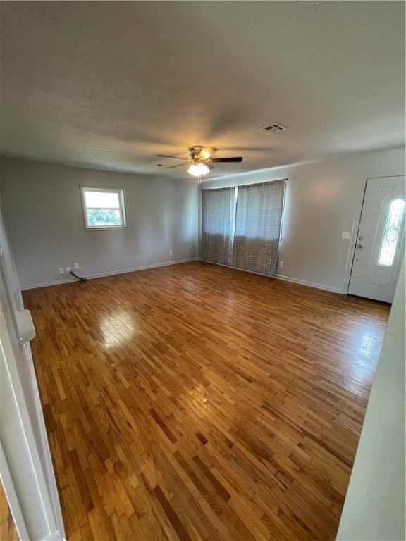 interior space featuring ceiling fan and wood-type flooring