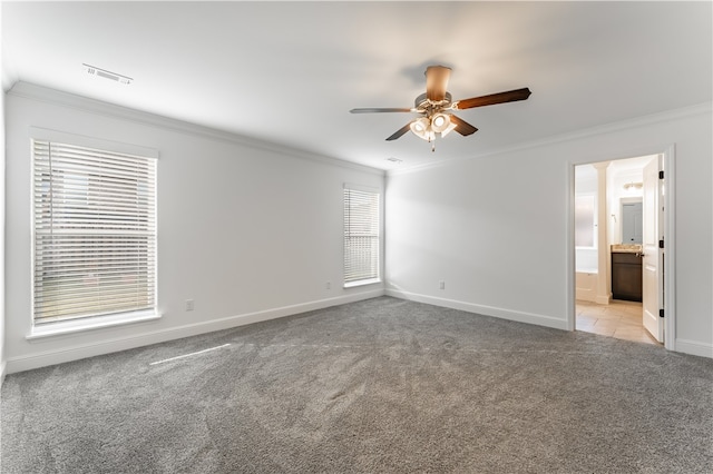 unfurnished room featuring light colored carpet, ceiling fan, and crown molding