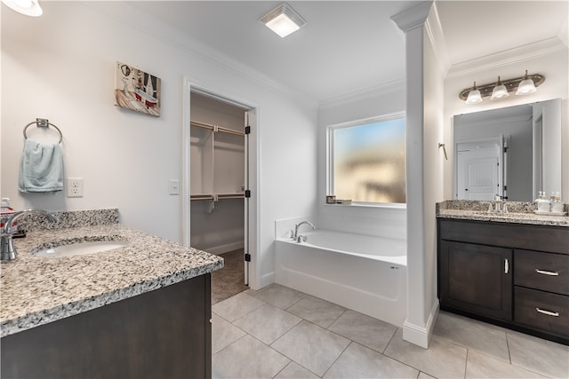 bathroom with vanity, a bath, tile patterned floors, and ornamental molding