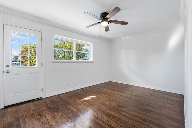 foyer entrance featuring dark wood-type flooring, ceiling fan, and ornamental molding