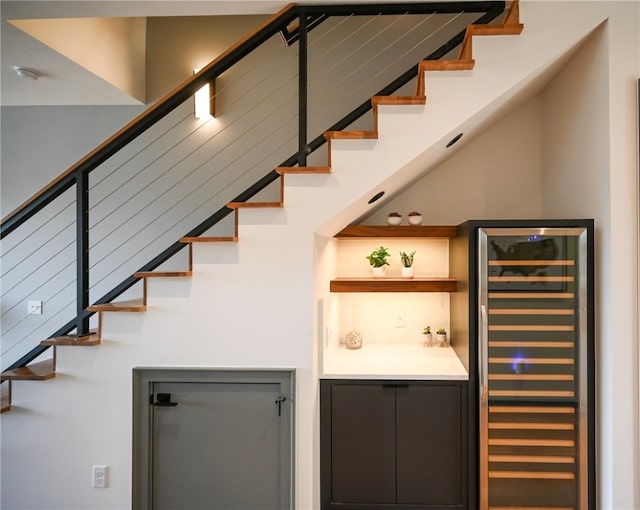 stairs featuring wine cooler