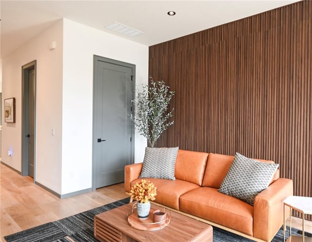 living room with light hardwood / wood-style flooring