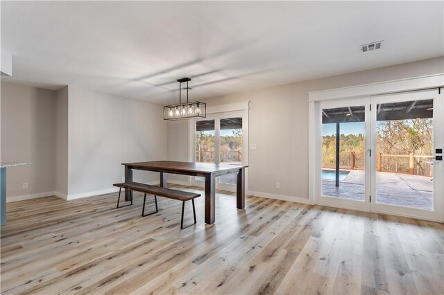 dining space with light wood-type flooring