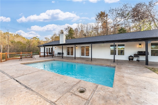 view of pool featuring a patio area