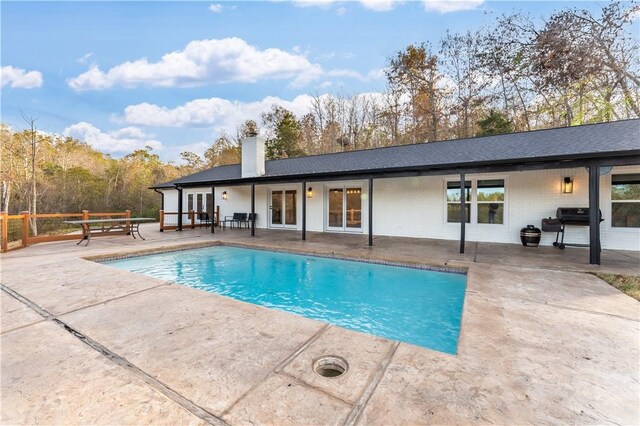 10729 Anzac Dr, Lowell, AR 72745 - outdoor pool with a patio, a grill, and french doors