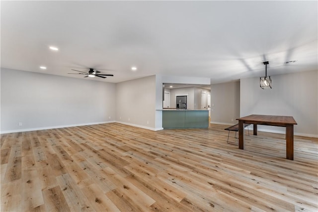 unfurnished living room featuring baseboards, light wood-style flooring, recessed lighting, and a ceiling fan
